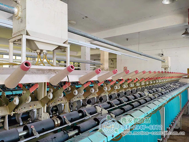 图为由编码器调节张力的关纱机照片